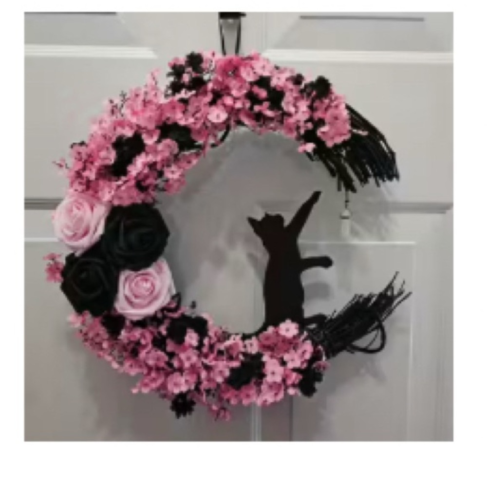 Pink and Black Floral Wreath with Cat Silhouette chasing a Dangling Crystal